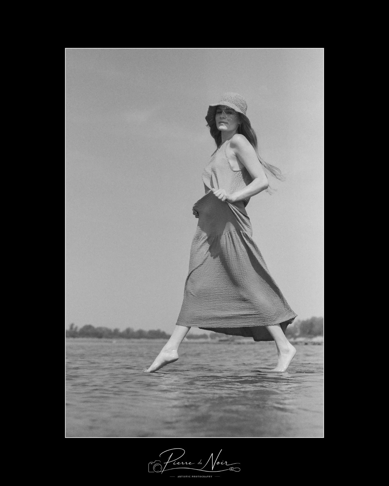 Barefoot girl strolling along the river